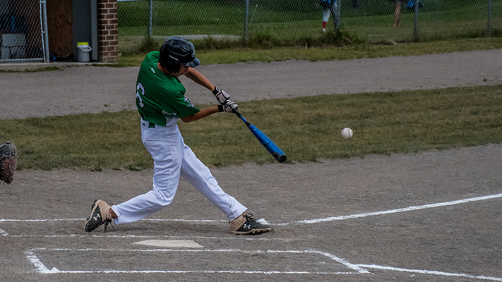Batter swinging at pitch.